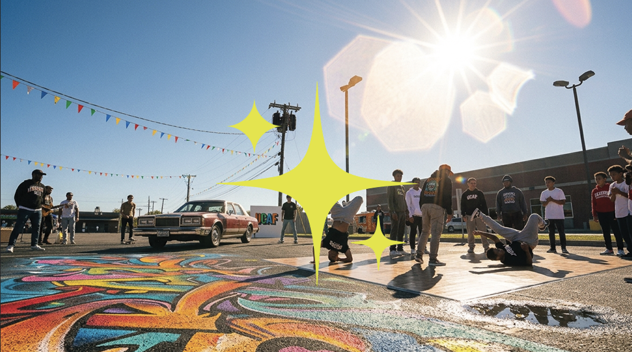 Lawton community members gathered around colorful street art during a promotional photo shoot